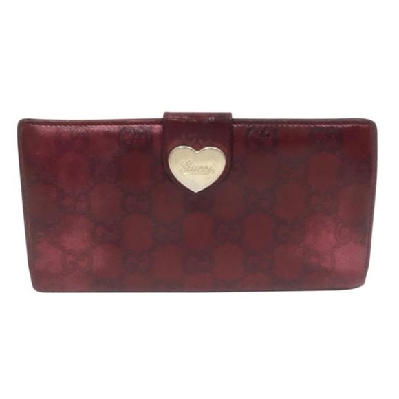 Gucci Handbags - Gucci burgundy monogram embossed leather heart long wallet